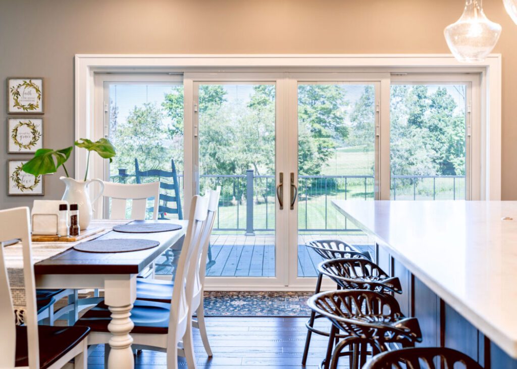Bright kitchen with view of outdoor deck.