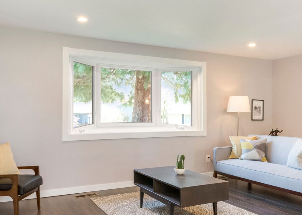 Modern living room with large window view.