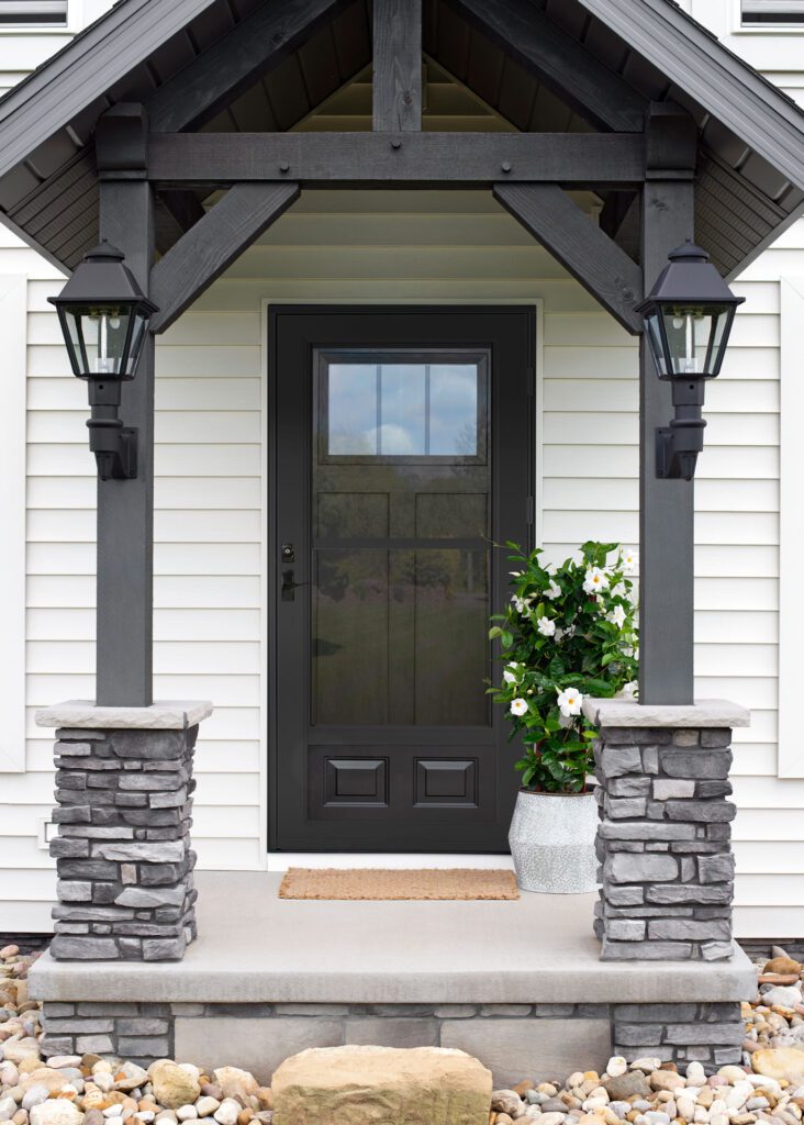 House entrance with black door and lanterns.