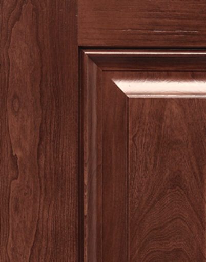Dark wooden cabinet door close-up.