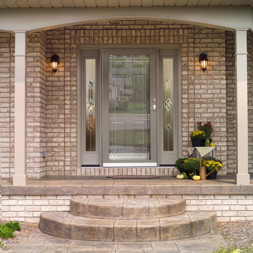 Front porch with decorative glass door.