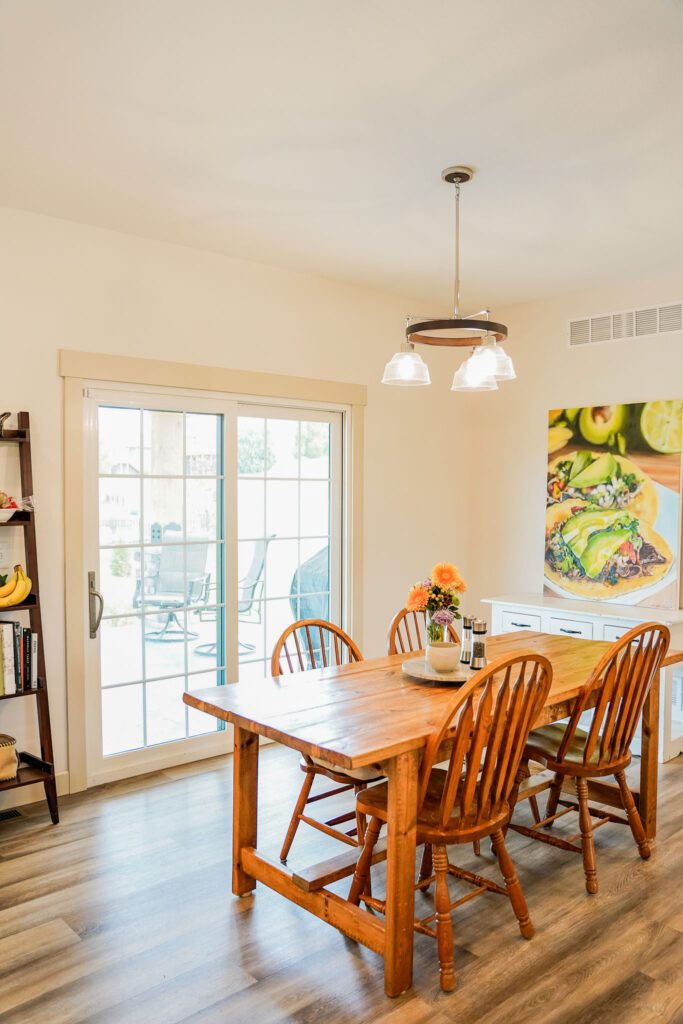 Dining room with wooden table and chairs.