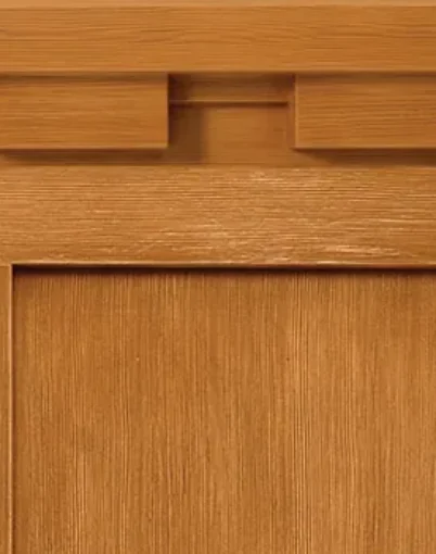 Wooden cabinet door with a recessed handle.
