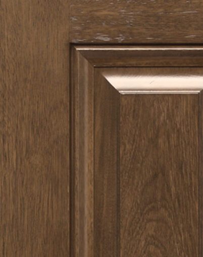 Brown wooden cabinet door with panel detail.